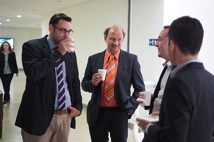Danny Chahbouni (Point Alpha Foundation), Robert Lebegern (German-German Museum Mödlareuth), Felix Glenk (HSF) and Dr. Christoph Nguyen (Free University of Berlin) conversing and discussing during the break